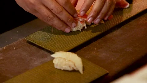 Chef Preparing Assorted Nigiri Sushi with Blowtorch and Precise Hand Placement Stock Footage 327116006
