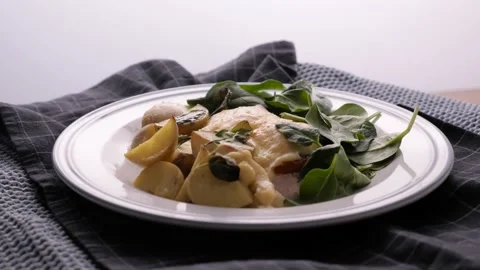 Chef preparing baked chicken fillet, cooking process, finished dish  Video stock 163833146