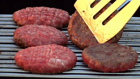 The chef preparing barbecue, turning roast burgers on grill. 4K shot. 스톡 동영상 108617087