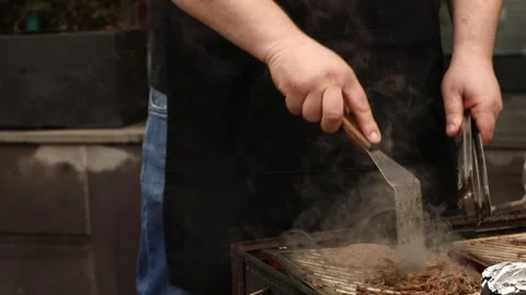 The chef is preparing a BBQ 11 Stock Footage 311763680
