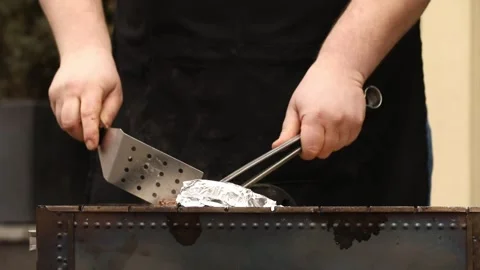 The chef is preparing a BBQ 3 Stock Footage 311763453
