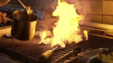 Chef Preparing BBQ Meat in Kitchen Grill on Open Fire Closeup Video stock 251789341