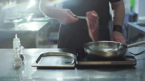 Chef preparing beef steak at kitchen in a restaurant Stock Footage 63446330