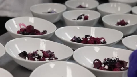 Chef preparing a beet salad for a catered dinner Stock Footage 317602329