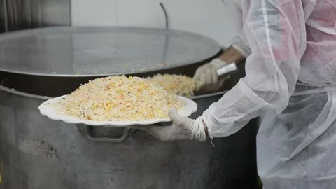Chef preparing biriyani rice with fully protected dress at the time of covid 19. Stock Footage 148205515