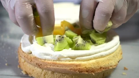 The chef is preparing a birthday or special day cake. Stock Footage 150088869