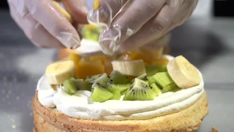 The chef is preparing a birthday or special day cake. Stock Footage 150088910
