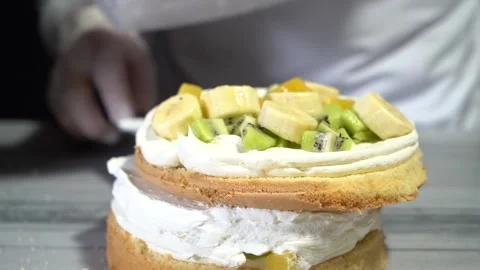 The chef is preparing a birthday or special day cake. Stock Footage 150089037