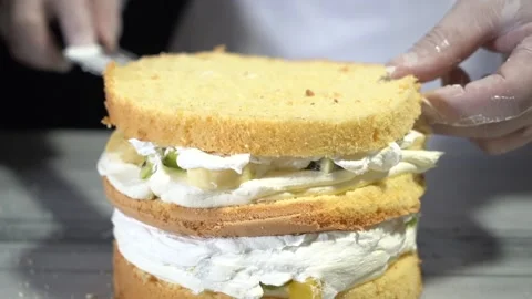 The chef is preparing a birthday or special day cake. Stock Footage 150089145