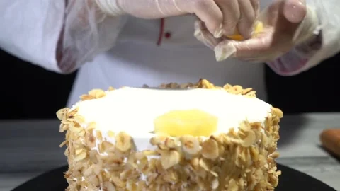 The chef is preparing a birthday or special day cake. Stock Footage 150089906
