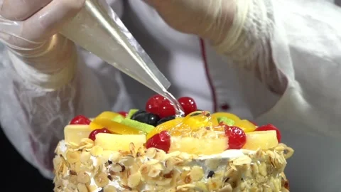 The chef is preparing a birthday or special day cake. Stock Footage 150090113