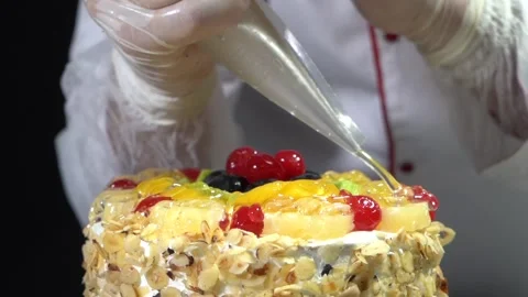 The chef is preparing a birthday or special day cake. Stock Footage 150090213
