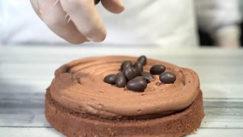 The chef is preparing a birthday or special day cake. Stock Footage 150090417