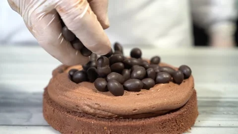 The chef is preparing a birthday or special day cake. Stock Footage 150090476