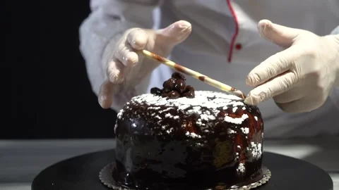 The chef is preparing a birthday or special day cake. Stock Footage 150090846