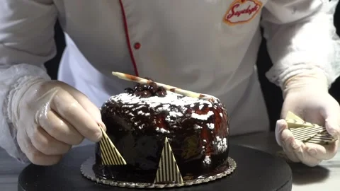 The chef is preparing a birthday or special day cake. Stock Footage 150091019