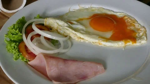 Chef preparing breakfast, Bacon and Eggs on white dish 스톡 동영상 81548217