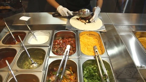 Chef preparing Burrito for customer Stock Footage 72475181
