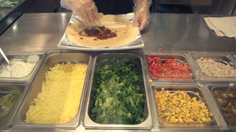 Chef preparing burrito in kitchen Stock Footage 65334553