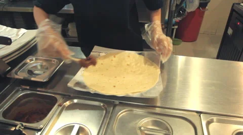 Chef preparing burrito in kitchen Video stock 65335804