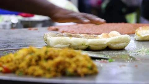 A chef preparing Butter Pav for Indian fast food dish Pav Bhaji Stock Footage 166854560