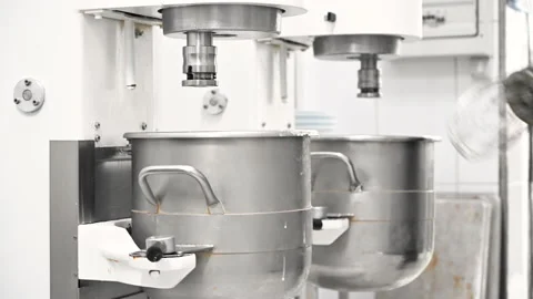 Chef Is Preparing Cake Mix In Industrial mixer- Kneading Machine Stock Footage 137641231