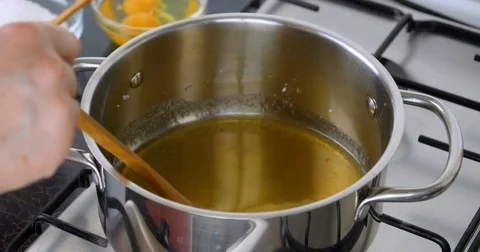 Chef preparing caramel sauce Stock Footage 75911912