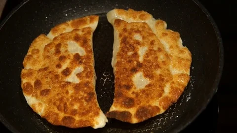 Chef preparing cheburek. Cooking process. Cooking pies. Fried meat pies Stock Footage 98244489