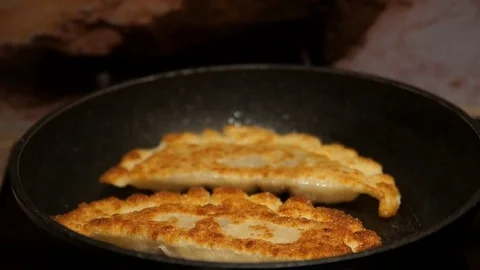 Chef preparing cheburek. Cooking process. Cooking pies. Fried meat pies Stock Footage 98244722