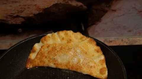 Chef preparing cheburek. Cooking process. Cooking pies. Fried meat pies Stock Footage 98244785