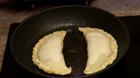 Chef preparing cheburek. Cooking process. Cooking pies. Fried meat pies Stock Footage 98245005