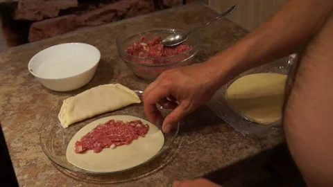 Chef preparing cheburek. Cooking process. Cooking pasties. Minced meat Stock Footage 98245105