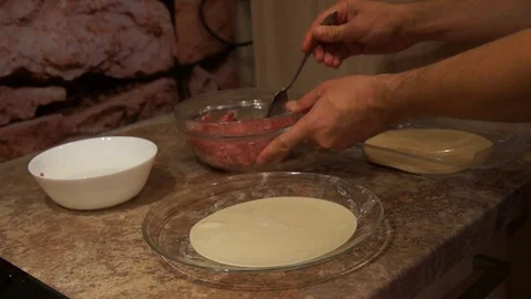 Chef preparing cheburek. Cooking process. Cooking pasties. Minced meat Stock Footage 98245306