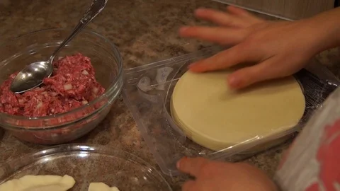Chef preparing cheburek. Cooking process. Cooking pasties. Minced meat Stock Footage 98486082