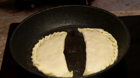 Chef preparing cheburek. Cooking process. Cooking pies. Fried meat pies Stock Footage 98486286