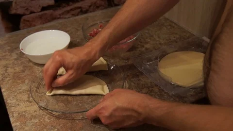 Chef preparing cheburek. Cooking process. Cooking pasties. Minced meat Stock Footage 98486408