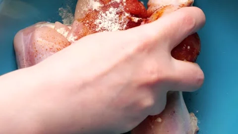 Chef preparing chicken legs for cooking Stock Footage 306237121