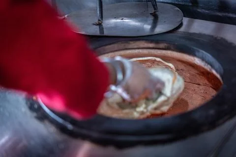 Chef preparing cooking and serving indian cuisine dish Stock Photos
