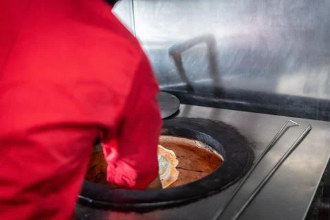 Chef preparing cooking and serving indian cuisine dish Stock Photos