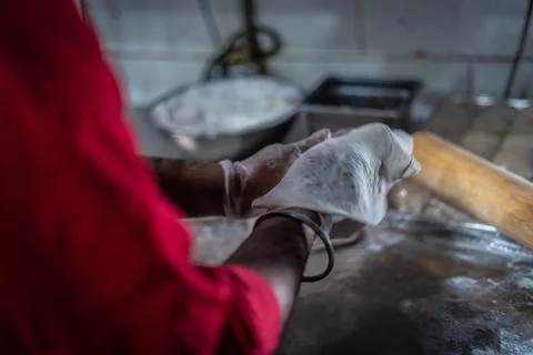 Chef preparing cooking and serving indian cuisine dish Stock Photos