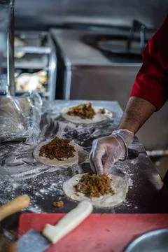 Chef preparing cooking and serving indian cuisine dish Stock-Fotos