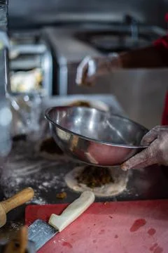 Chef preparing cooking and serving indian cuisine dish Stock Photos