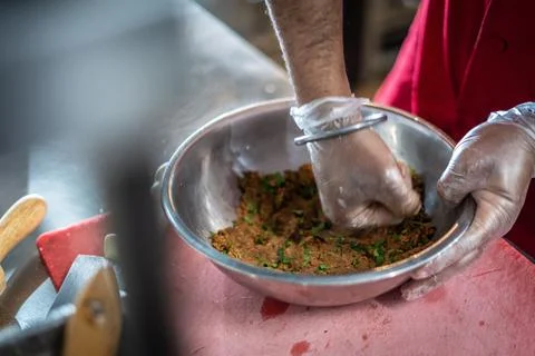 Chef preparing cooking and serving indian cuisine dish Stock Photos