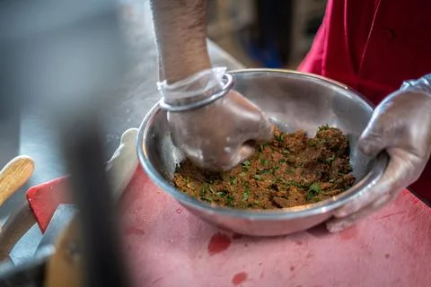 Chef preparing cooking and serving indian cuisine dish Stock Photos