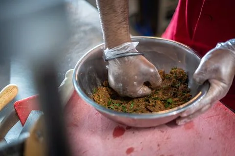 Chef preparing cooking and serving indian cuisine dish Stock Photos