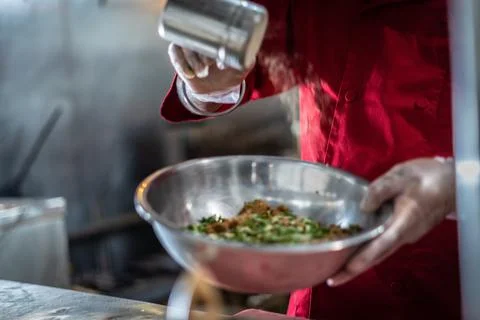 Chef preparing cooking and serving indian cuisine dish Stock Photos