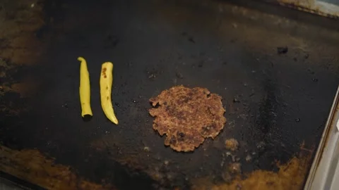 The chef is preparing delicious smashed burgers in the kitchen Stock Footage 294955235