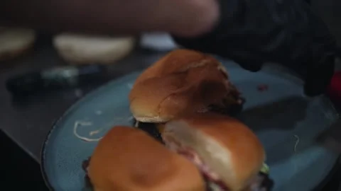 The chef is preparing delicious smashed burgers in the kitchen Stock Footage 294955275