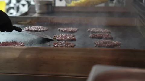 The chef is preparing delicious smashed burgers in the kitchen Stock Footage 294955795
