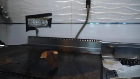 The chef is preparing delicious smashed burgers in the kitchen Stock Footage 294955809